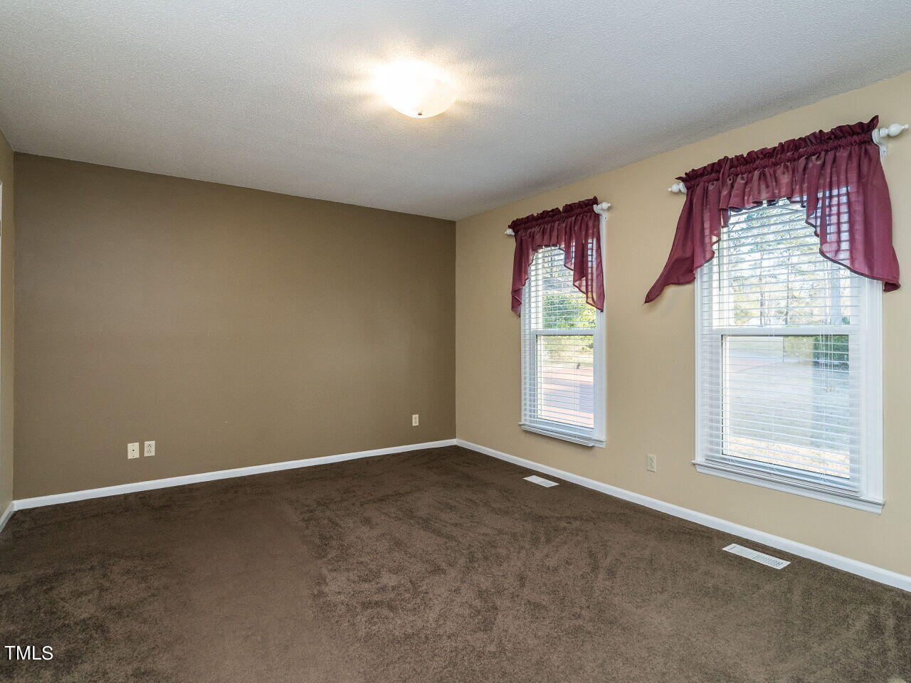 402 Hillside Drive Smithfield, NC 27577 - Photo 15 of 27 an empty room with windows