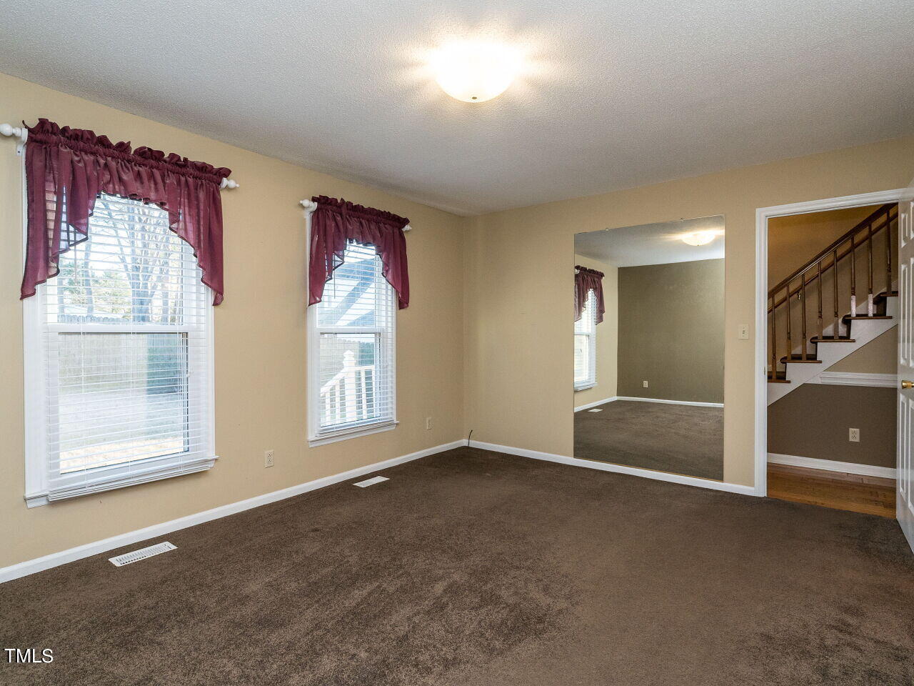 402 Hillside Drive Smithfield, NC 27577 - Photo 17 of 27 an empty room with windows and closet