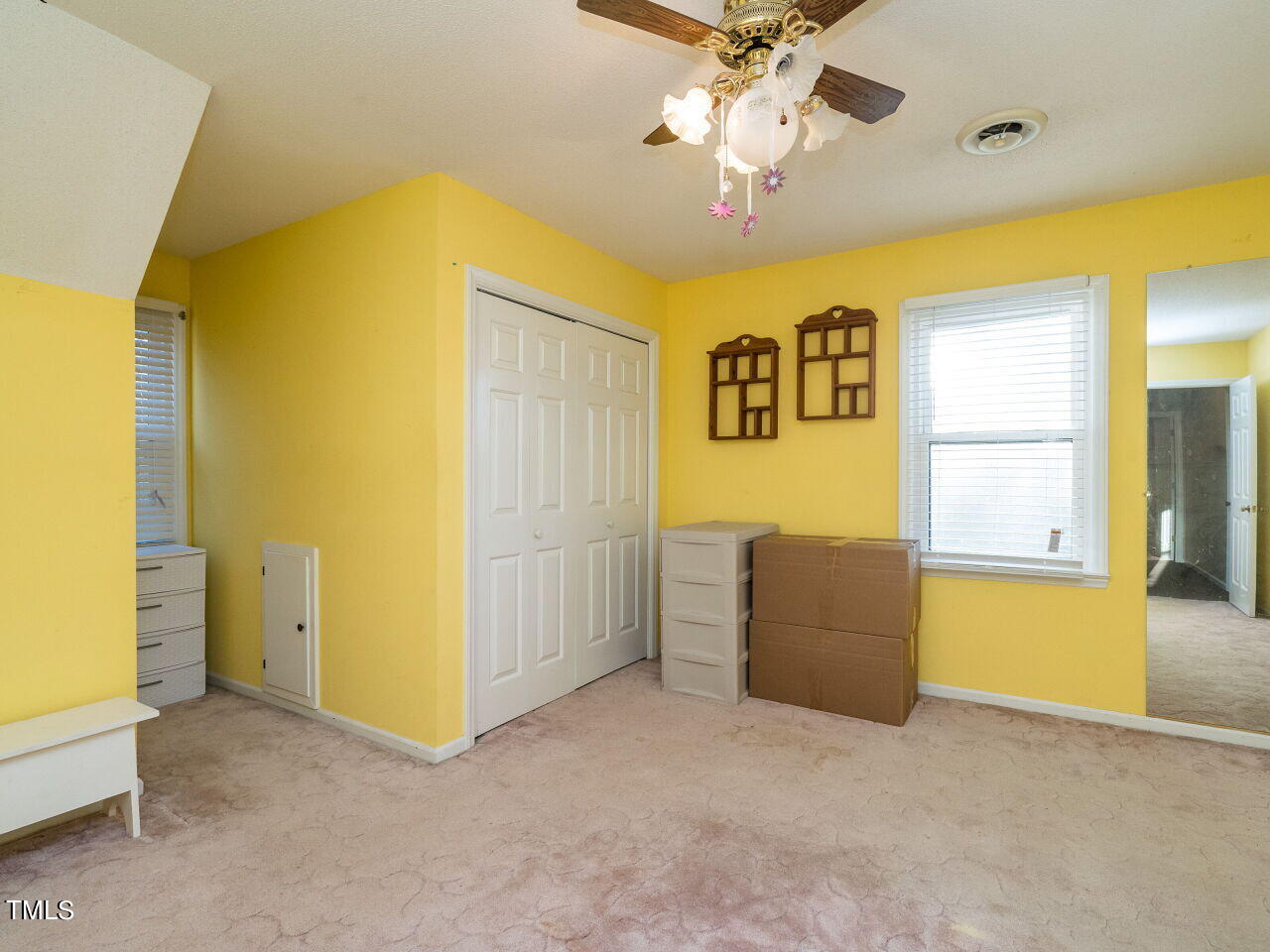 402 Hillside Drive Smithfield, NC 27577 - Photo 18 of 27 an empty room with a window and a ceiling fan