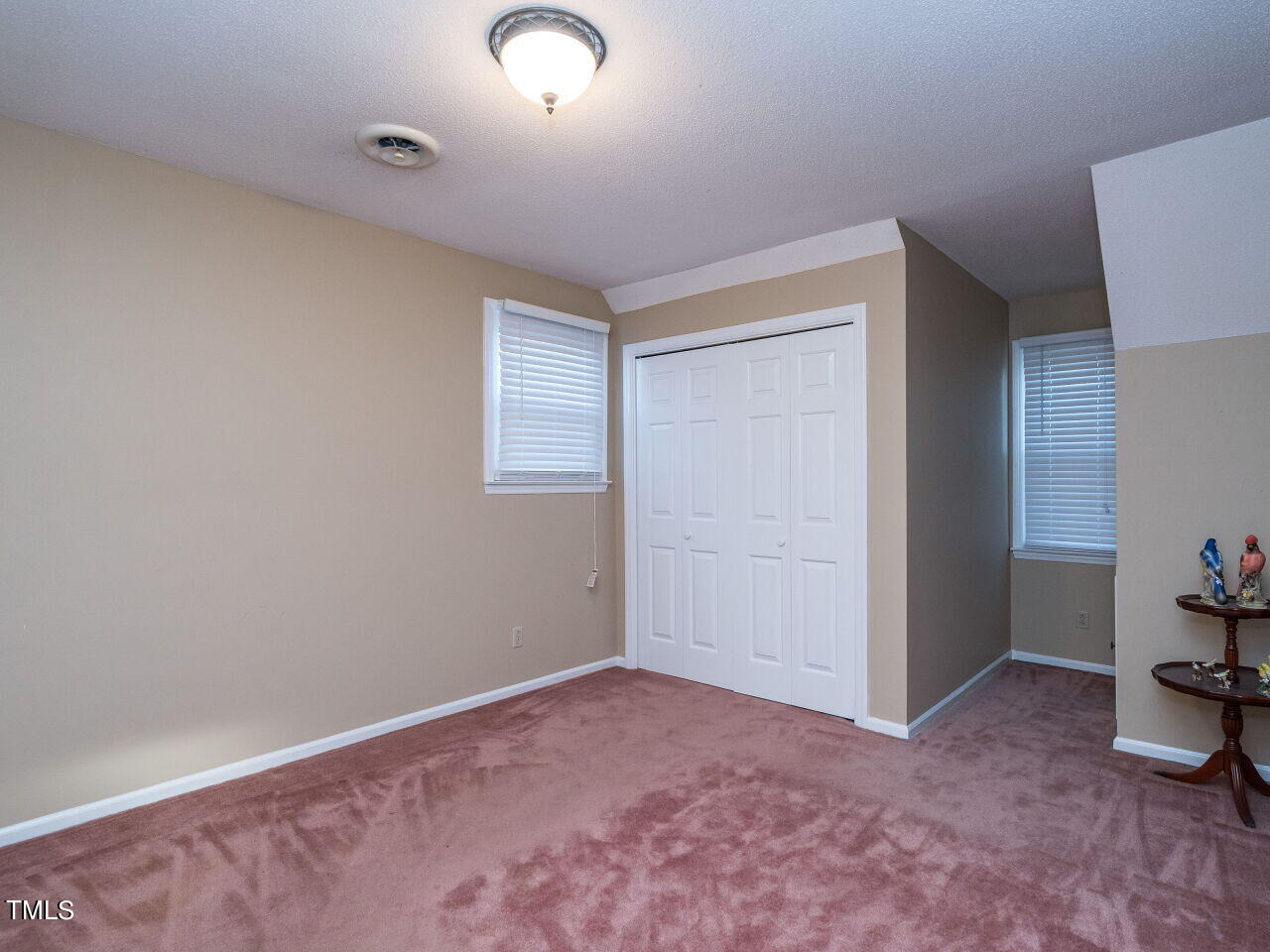 402 Hillside Drive Smithfield, NC 27577 - Photo 21 of 27 an empty room with windows and natural light