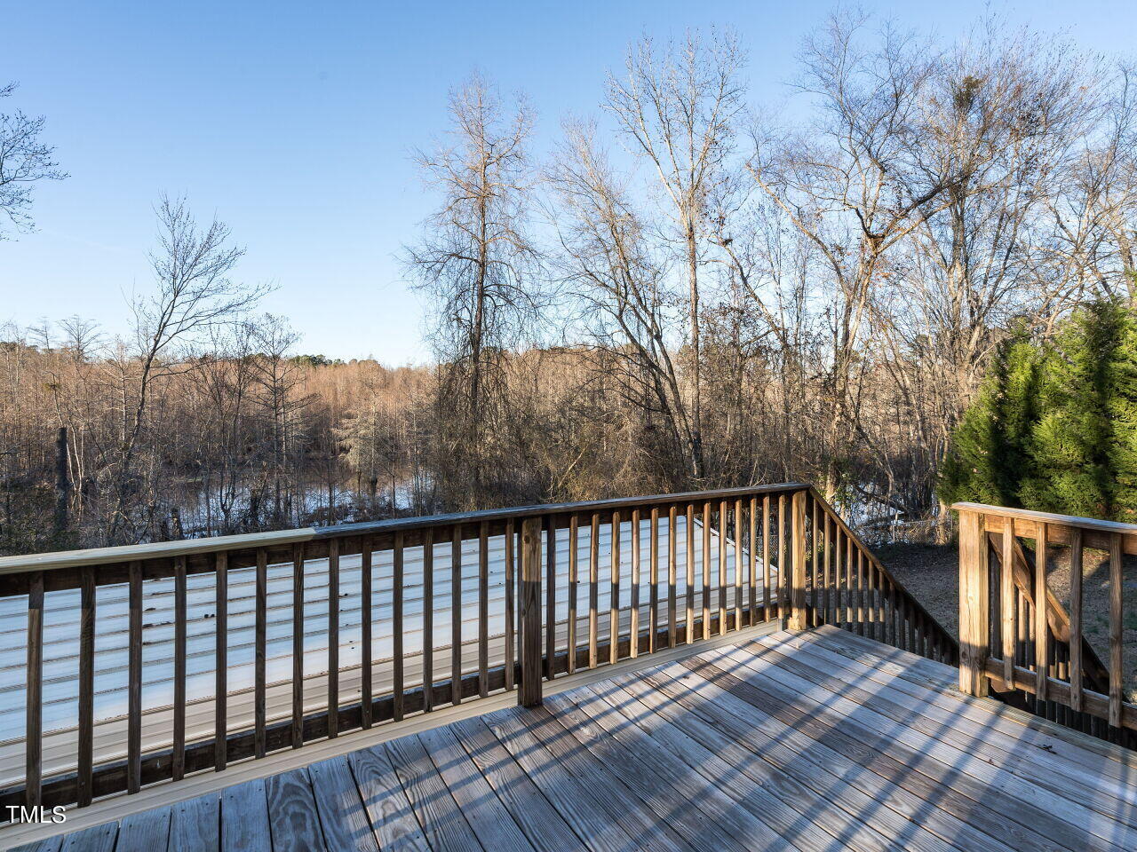 402 Hillside Drive Smithfield, NC 27577 - Photo 23 of 27 a balcony with wooden floor and fence