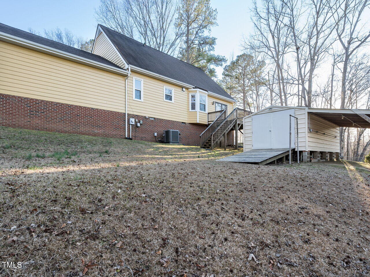 402 Hillside Drive Smithfield, NC 27577 - Photo 26 of 27 a view of a house with backyard and trees