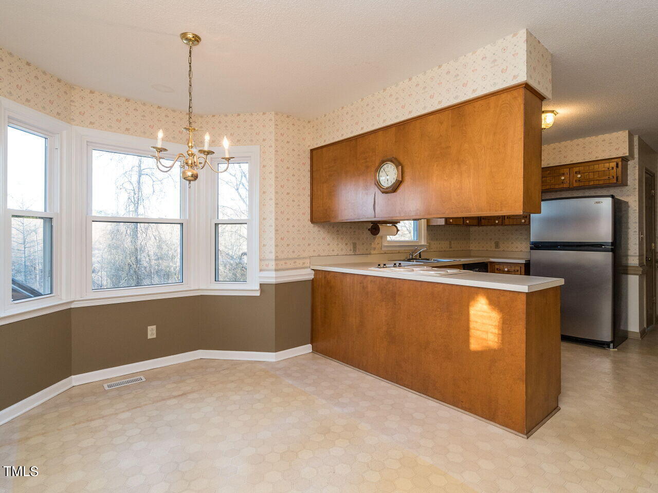 402 Hillside Drive Smithfield, NC 27577 - Photo 9 of 27 a kitchen with stainless steel appliances granite countertop a stove a sink and a microwave