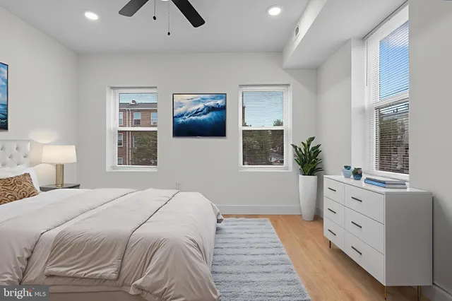 a bedroom with a large bed and a window