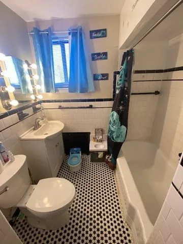 a room with furniture and a flat screen tv