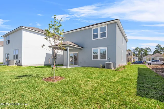 a view of a lake with a big yard