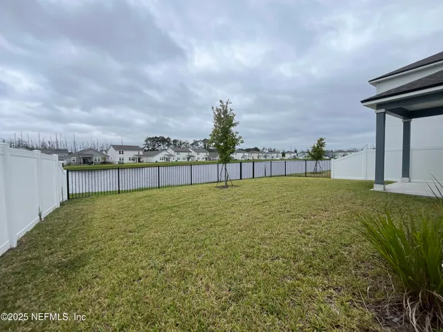 view of a hallway with paintings on wall