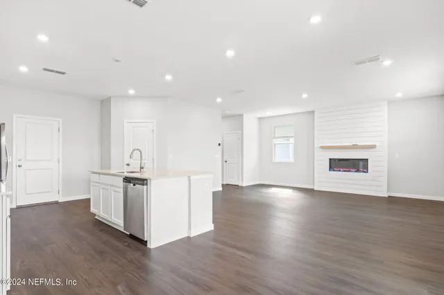 a view of kitchen with stainless steel appliances refrigerator oven and stove