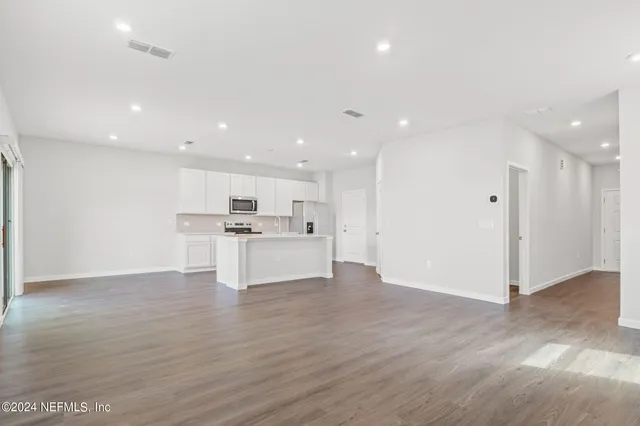 a view of kitchen with wooden floor