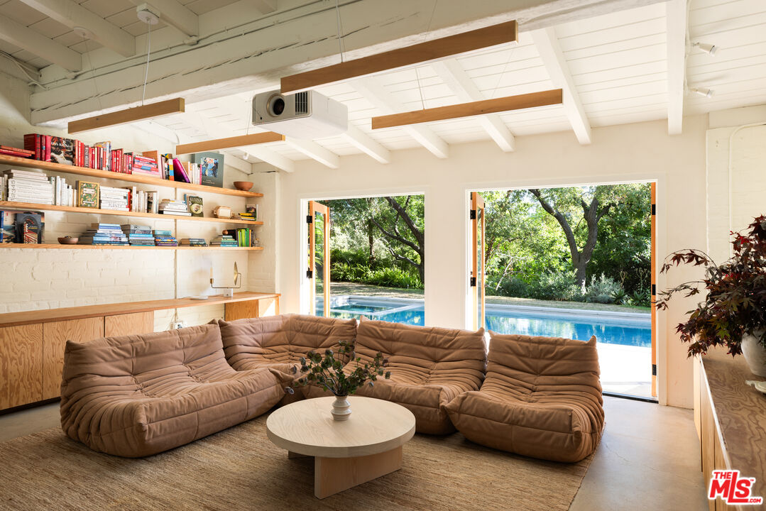1830 Old Orchard Road Los Angeles, CA 90049 - Photo 12 of 30 a living room with furniture and a large window