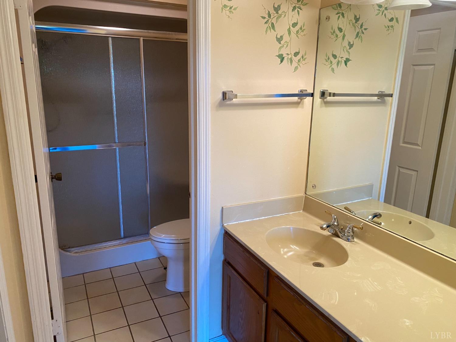 107 Manor Drive Forest, VA 24551 - Photo 12 of 20 a bathroom with a sink toilet and shower
