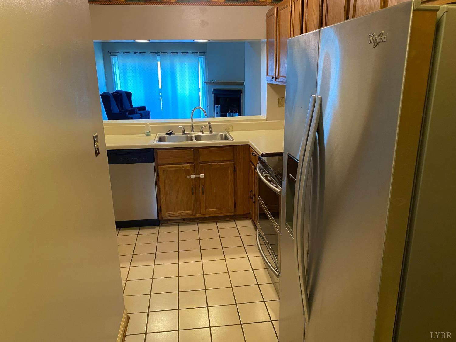 107 Manor Drive Forest, VA 24551 - Photo 6 of 20 a kitchen with a refrigerator sink and cabinets