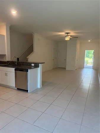 a kitchen with stainless steel appliances granite countertop a sink and a stove