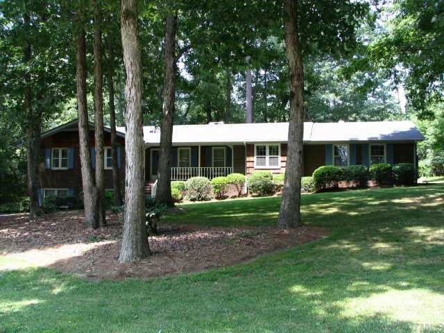 3901 Valley Stream Drive Raleigh, NC 27604 - Photo 1 of 1 a view of a house with backyard and a tree