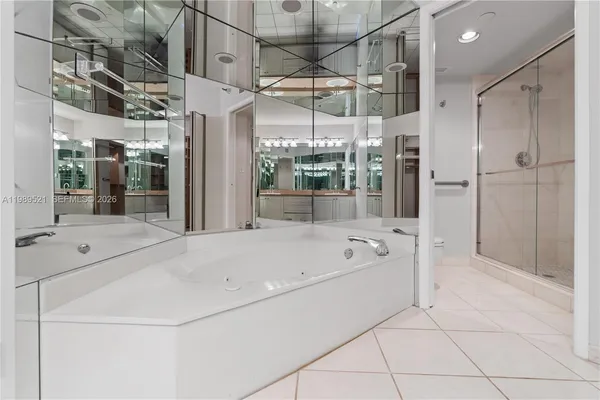 a bathroom with a glass shower door