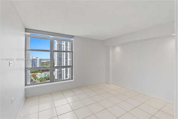 a view of an empty room and window