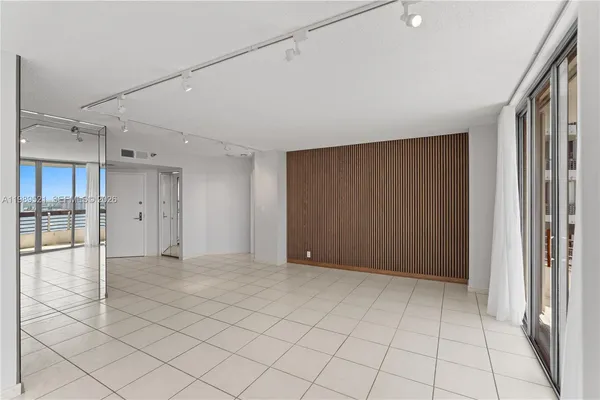 a view of an empty room and window