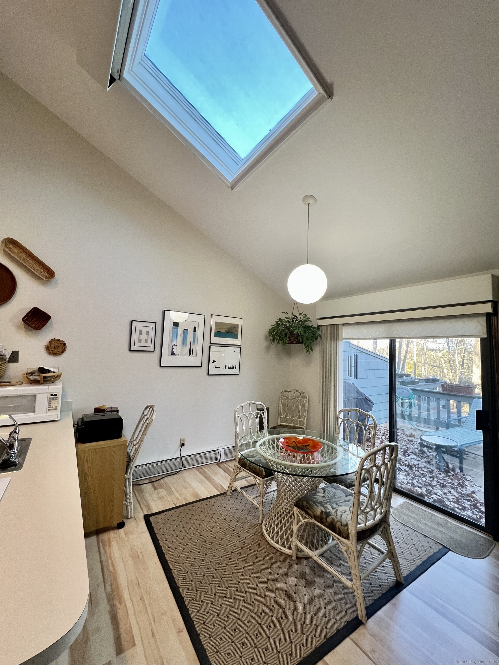 207 Ledge Drive Torrington, CT 06790 - Photo 10 of 18 a living room with furniture a large window and wooden floor