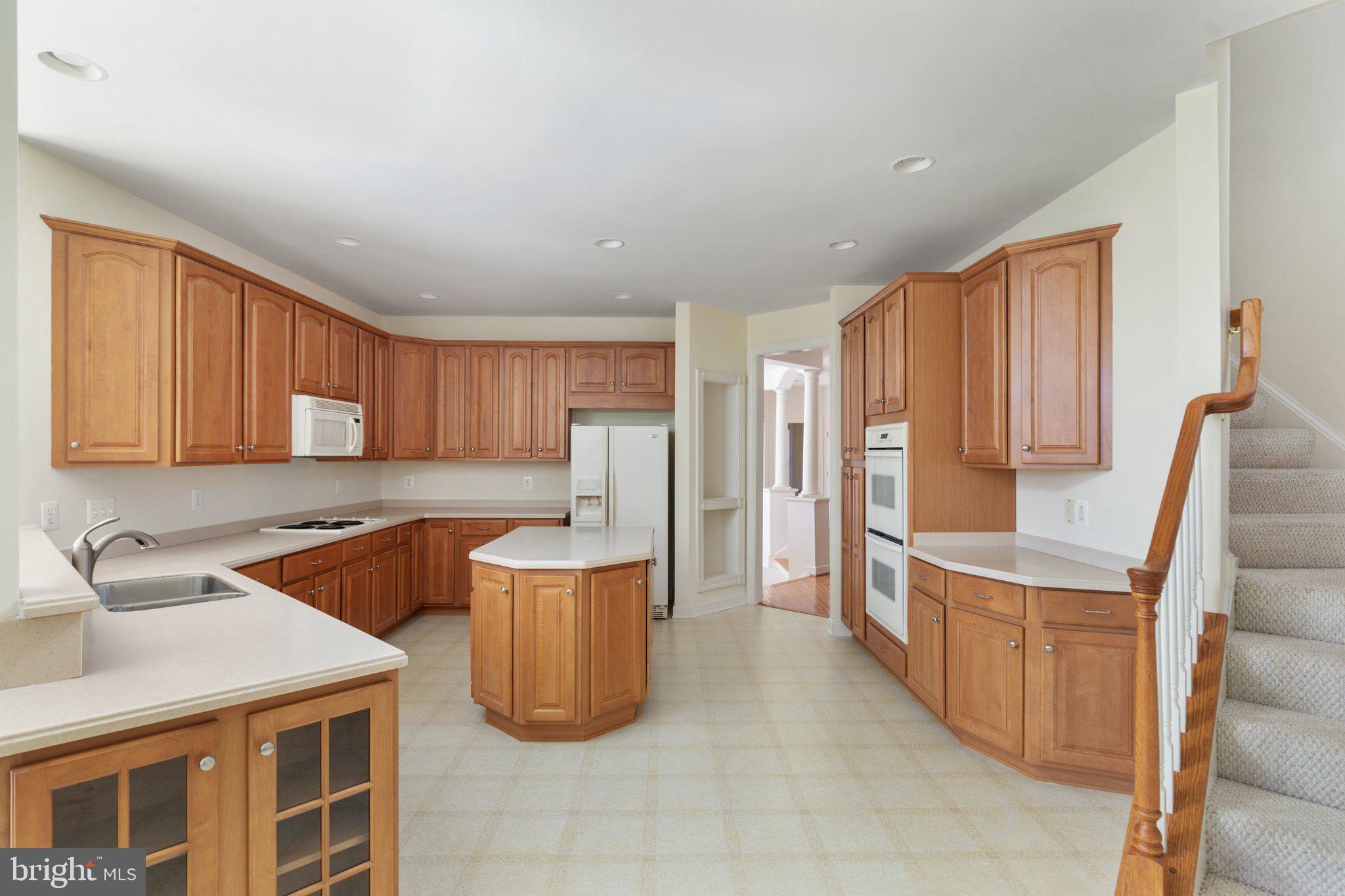 5664 Lick River Lane Gainesville, VA 20155 - Photo 14 of 43 kitchen with Corian countertops and double ovens