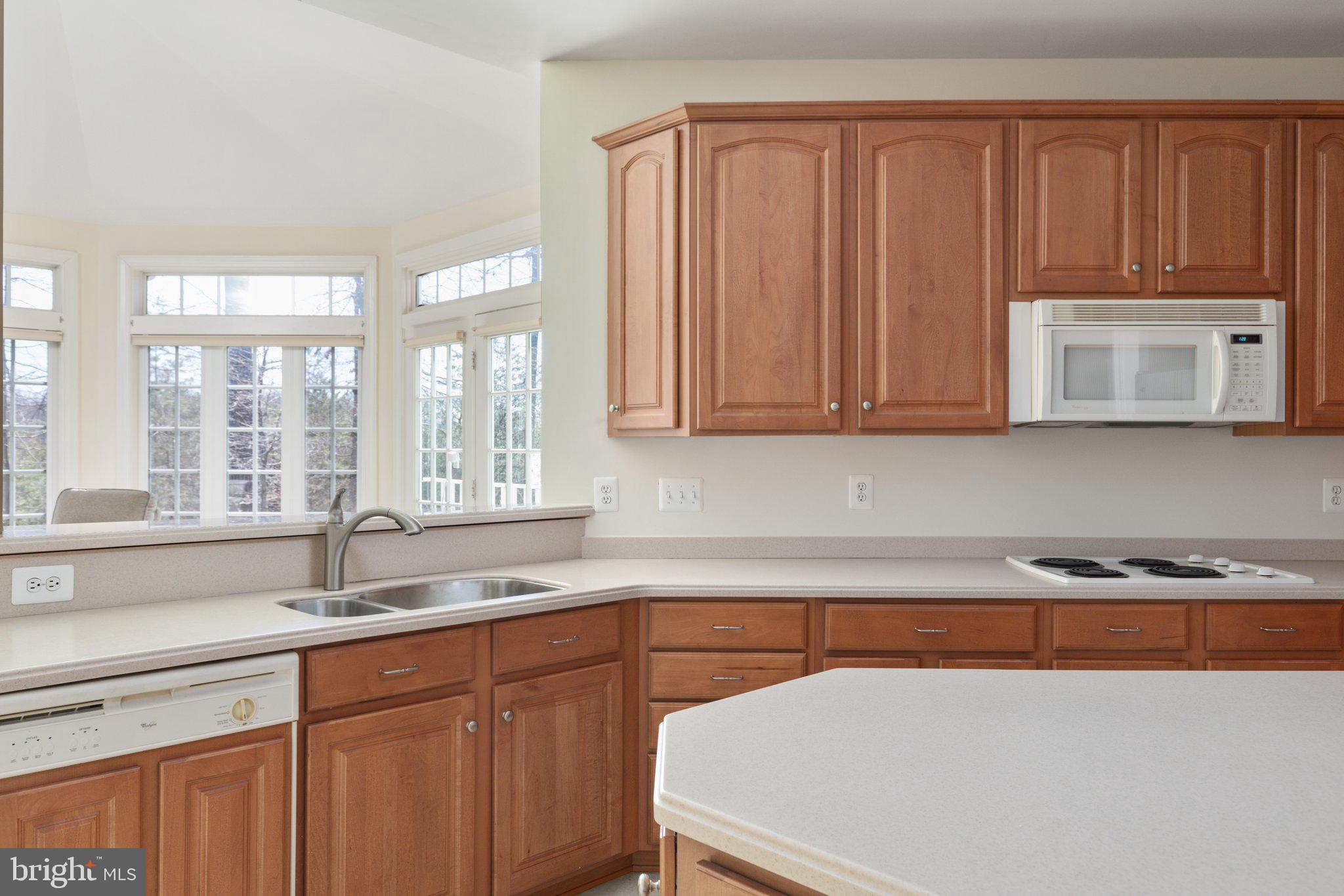 5664 Lick River Lane Gainesville, VA 20155 - Photo 16 of 43 Kitchen sink looks out over morning room