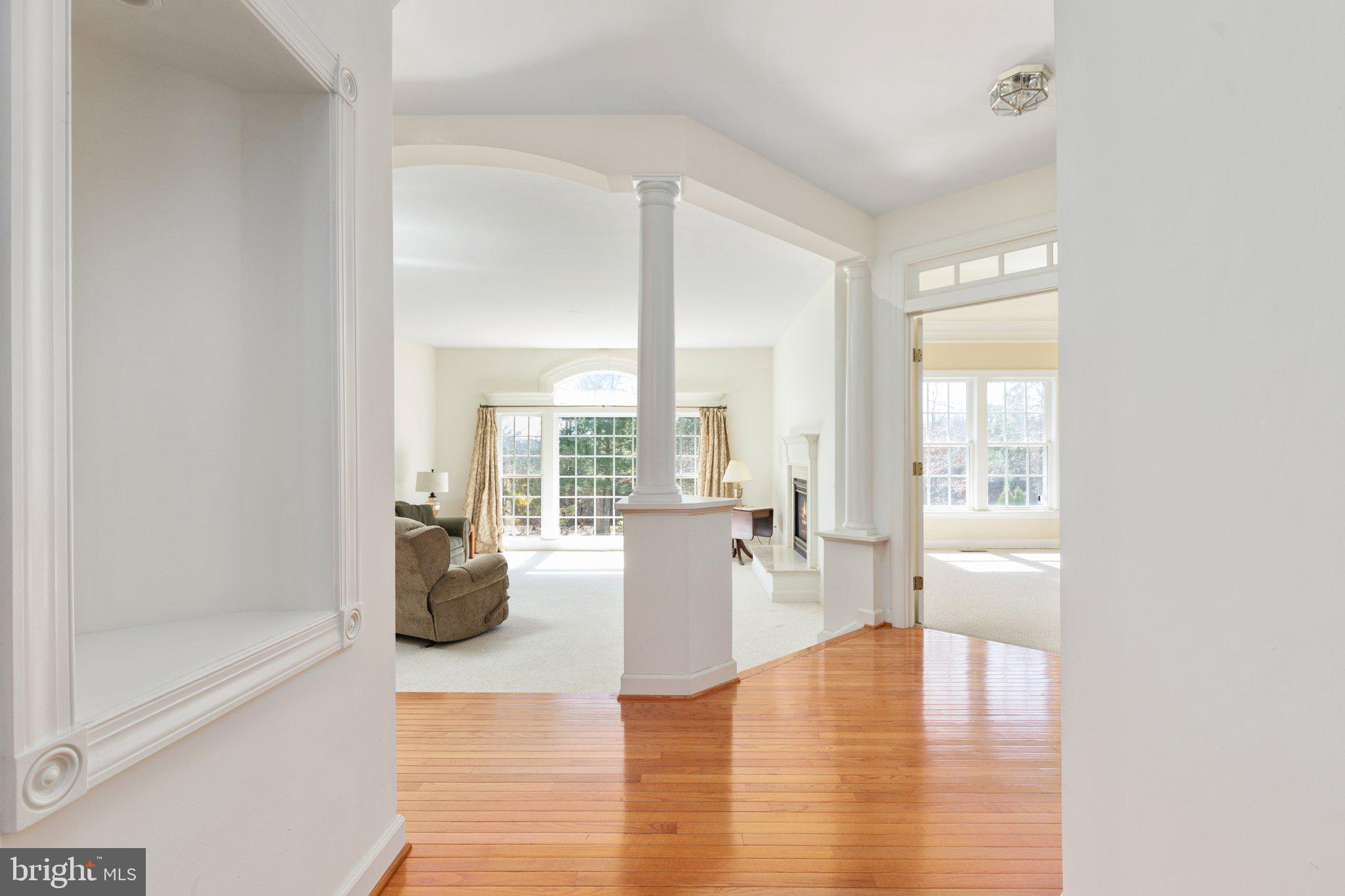 5664 Lick River Lane Gainesville, VA 20155 - Photo 7 of 43 Step down from hardwoods into the cozy family room