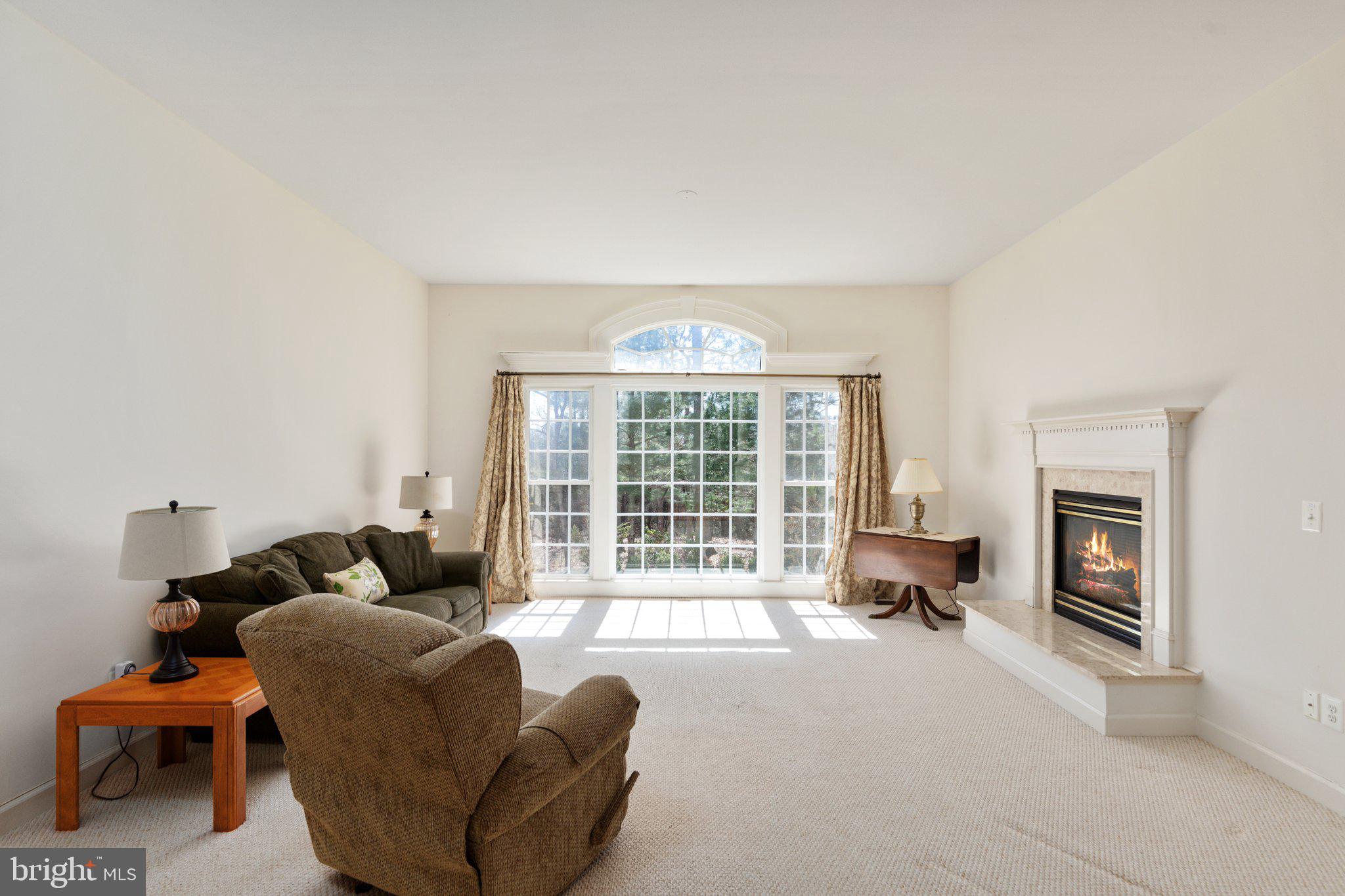 5664 Lick River Lane Gainesville, VA 20155 - Photo 8 of 43 The family room looks out over the backyard