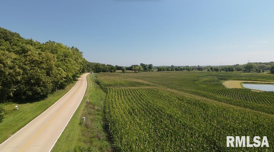 0 Dunn Road Camanche, IA 52730 - Photo 3 of 4 a view of a lake with a big yard