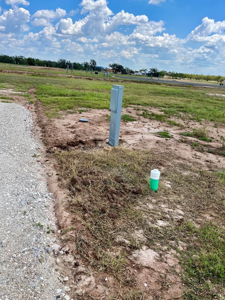 193 Arch Ray Loop, Unit 193 Fredericksburg, TX 78624 - Photo 4 of 4 a view of a lake with a beach