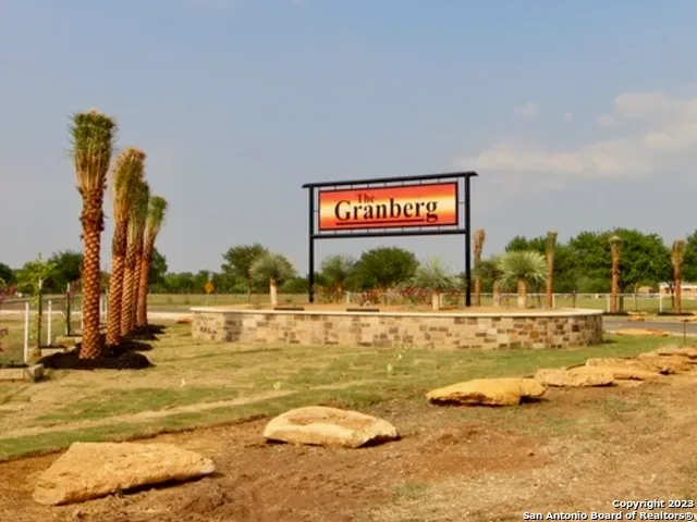 a view of a swimming pool and an outdoor space