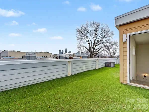 a view of a yard with an outdoor seating