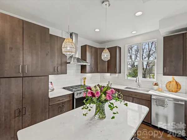 a kitchen with sink cabinets and window