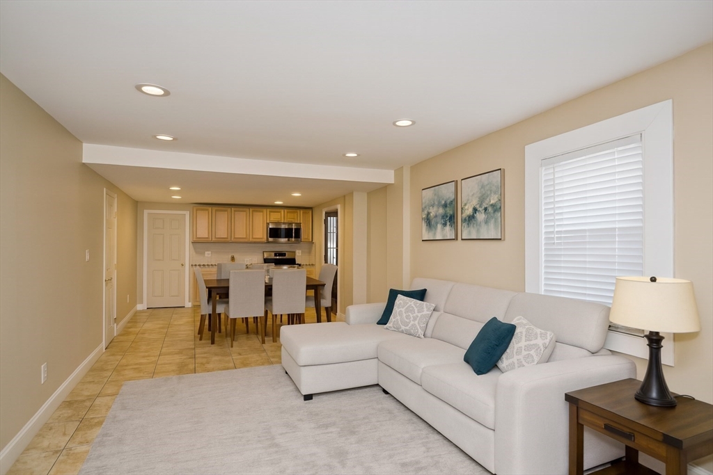 a living room with furniture and a table