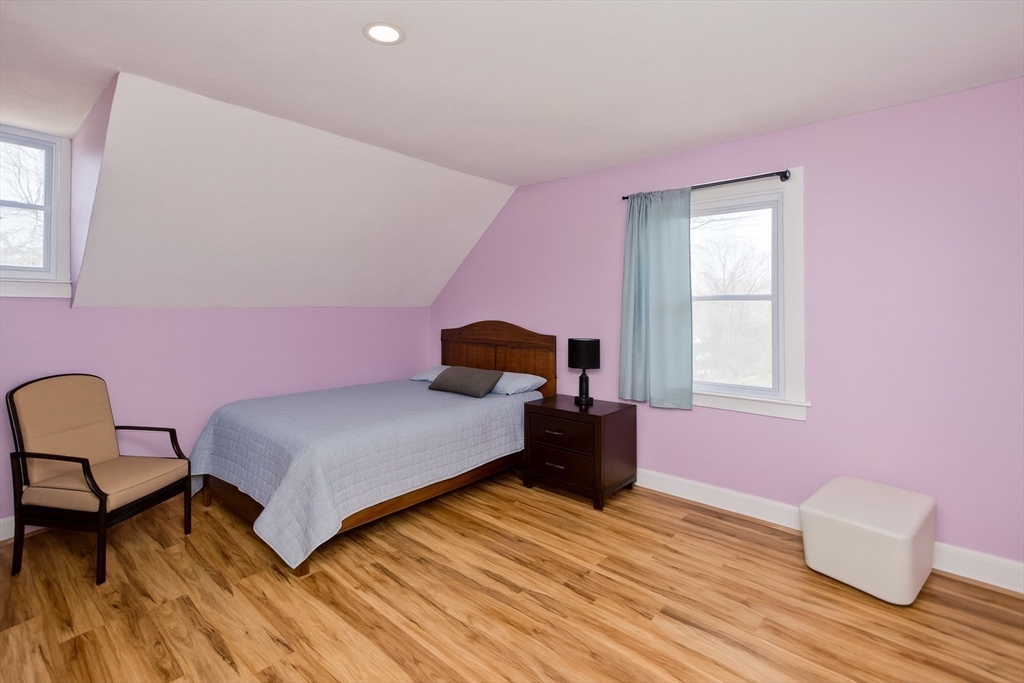 34 Temby Street Springfield, MA 01119 - Photo 12 of 22 a bedroom with a bed and wooden floor