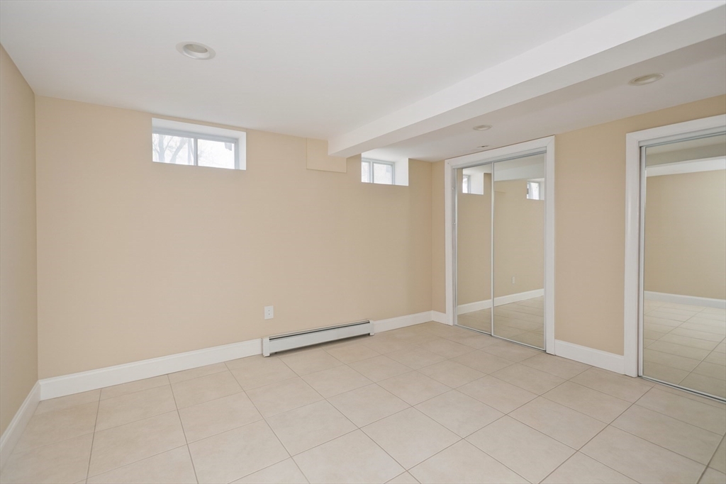 34 Temby Street Springfield, MA 01119 - Photo 13 of 22 wooden floor in an empty room