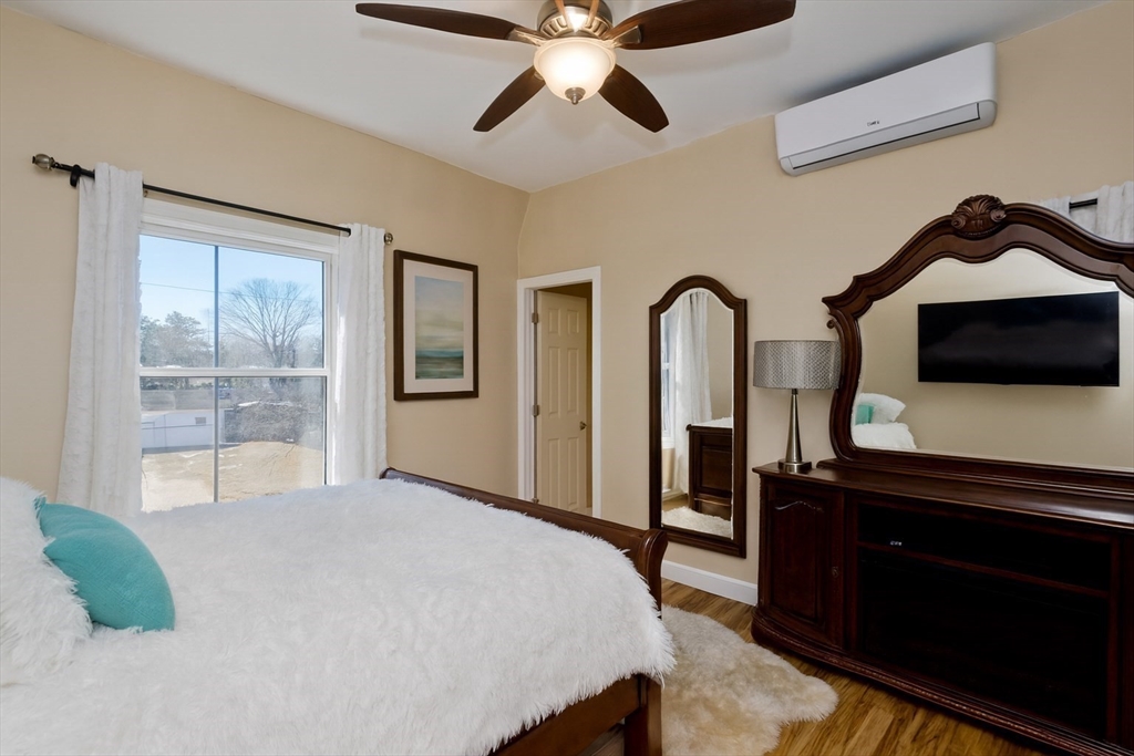 34 Temby Street Springfield, MA 01119 - Photo 6 of 22 a bedroom with a bed and a dresser