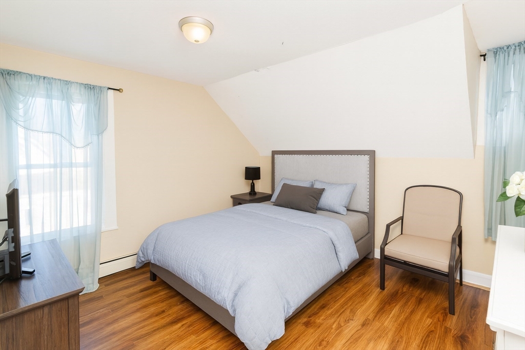 34 Temby Street Springfield, MA 01119 - Photo 9 of 22 a bedroom with a bed and a window