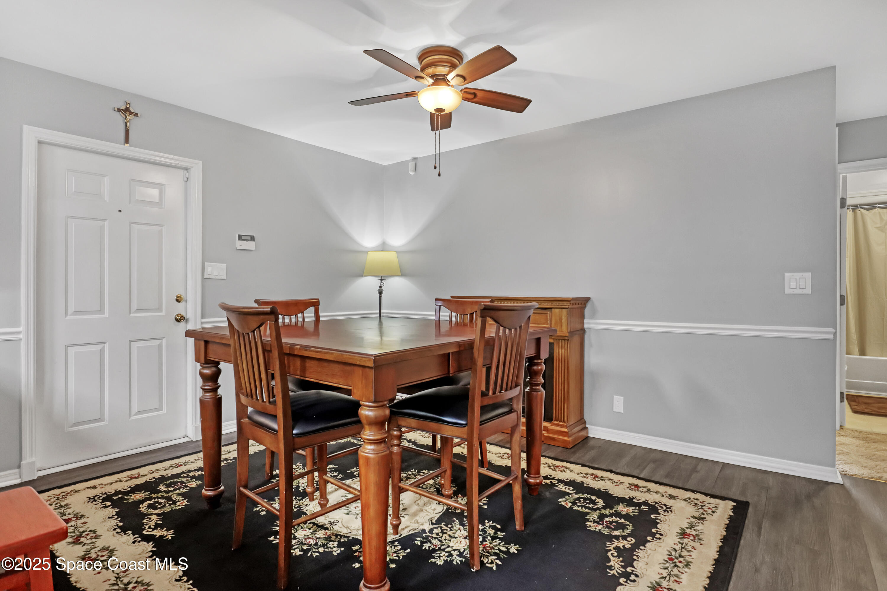 5280 Curtis Boulevard Cocoa, FL 32927 - Photo 17 of 45 a view of a dining room with furniture and wooden floor