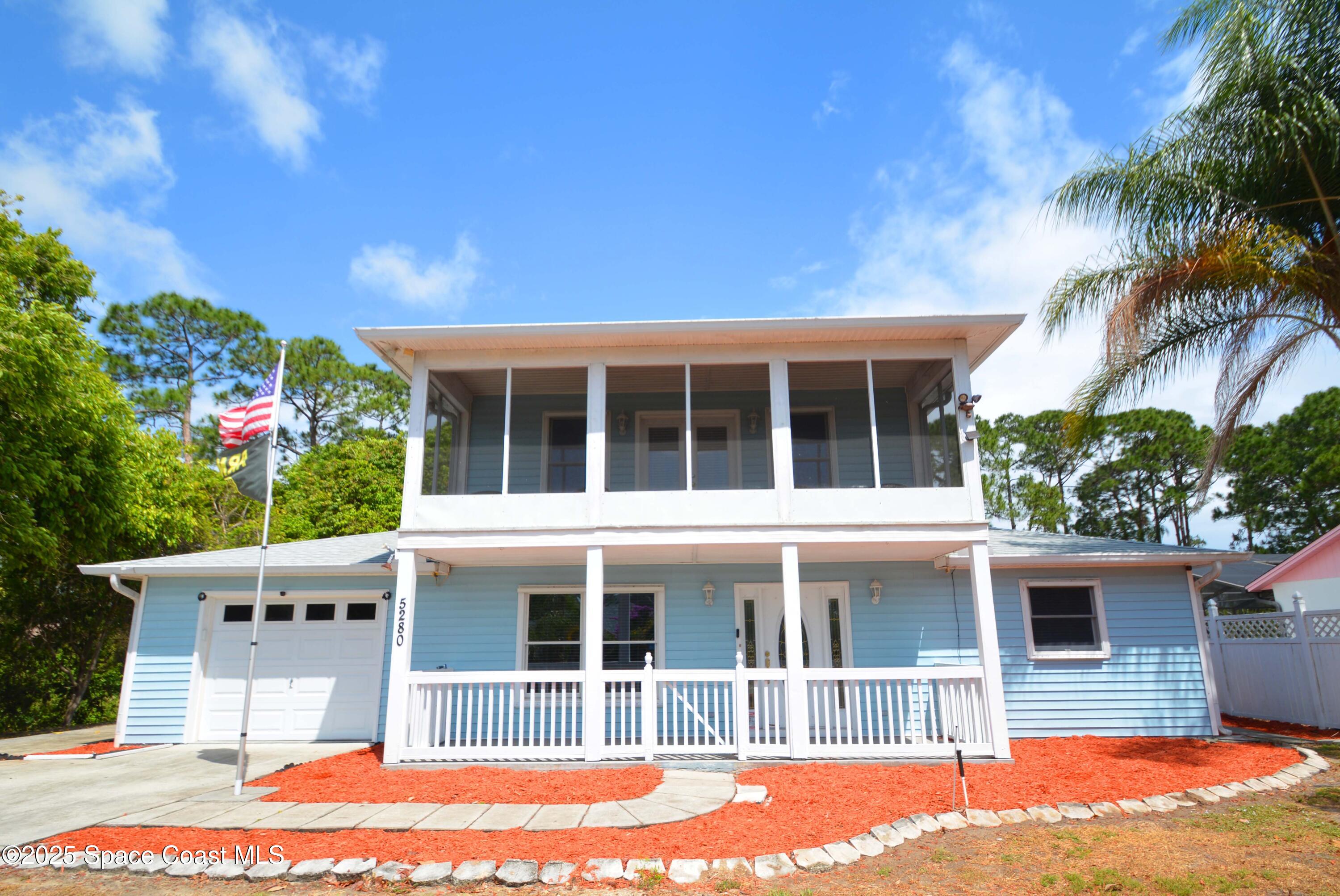 5280 Curtis Boulevard Cocoa, FL 32927 - Photo 2 of 45 a house view with a garden space