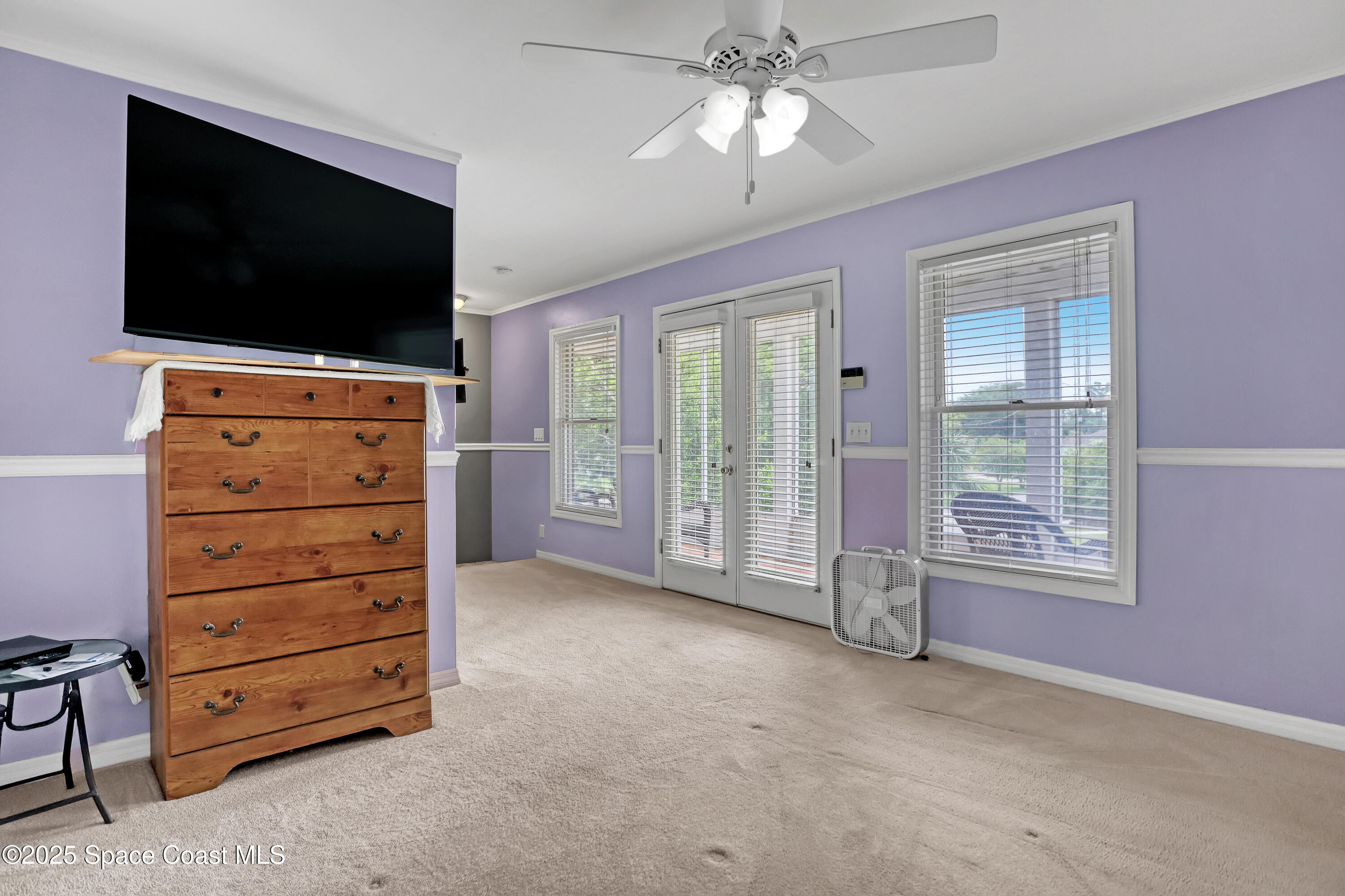 5280 Curtis Boulevard Cocoa, FL 32927 - Photo 27 of 45 a view of a livingroom with furniture and a flat screen tv