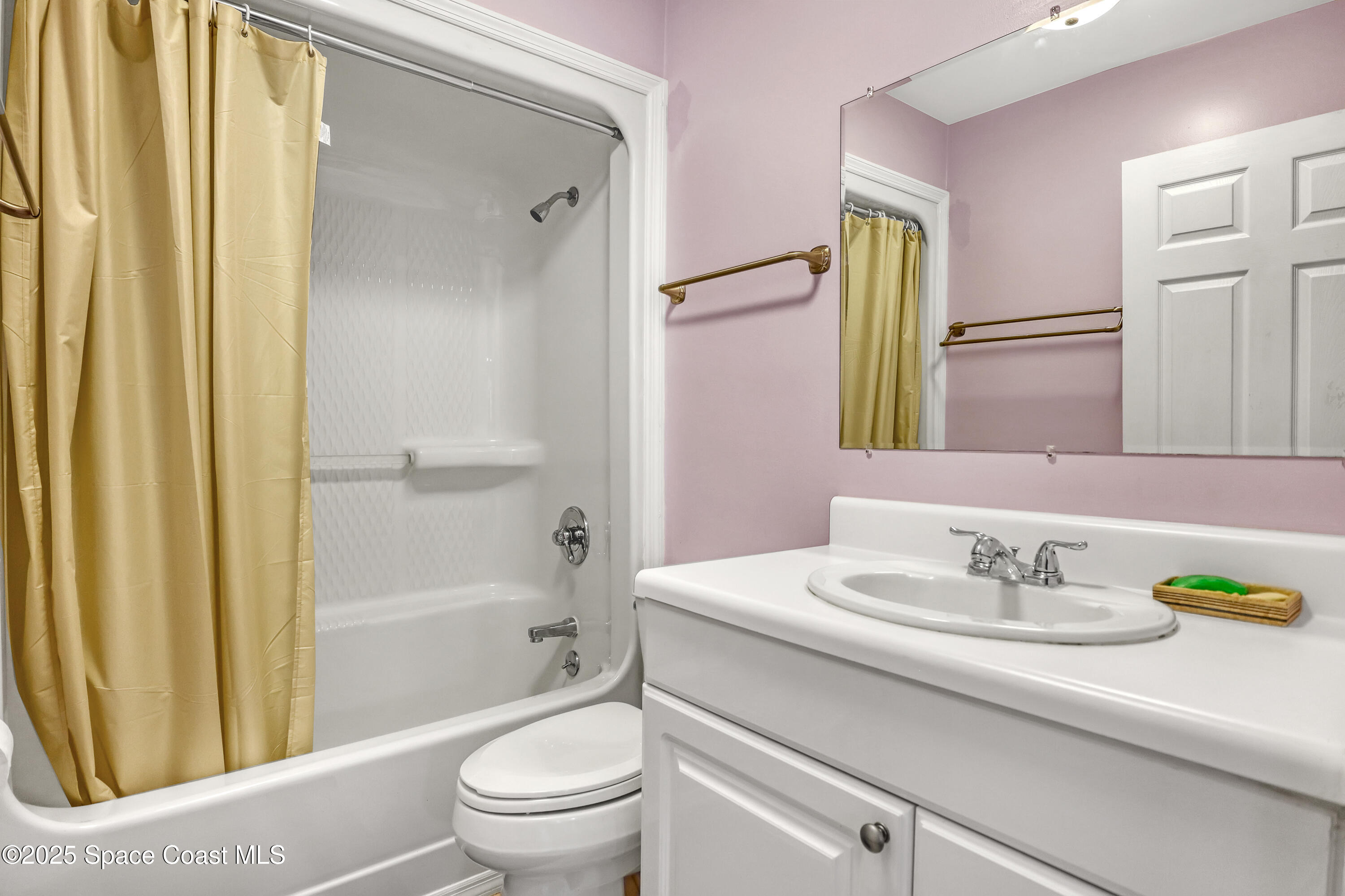 5280 Curtis Boulevard Cocoa, FL 32927 - Photo 34 of 45 a bathroom with a sink a toilet and shower