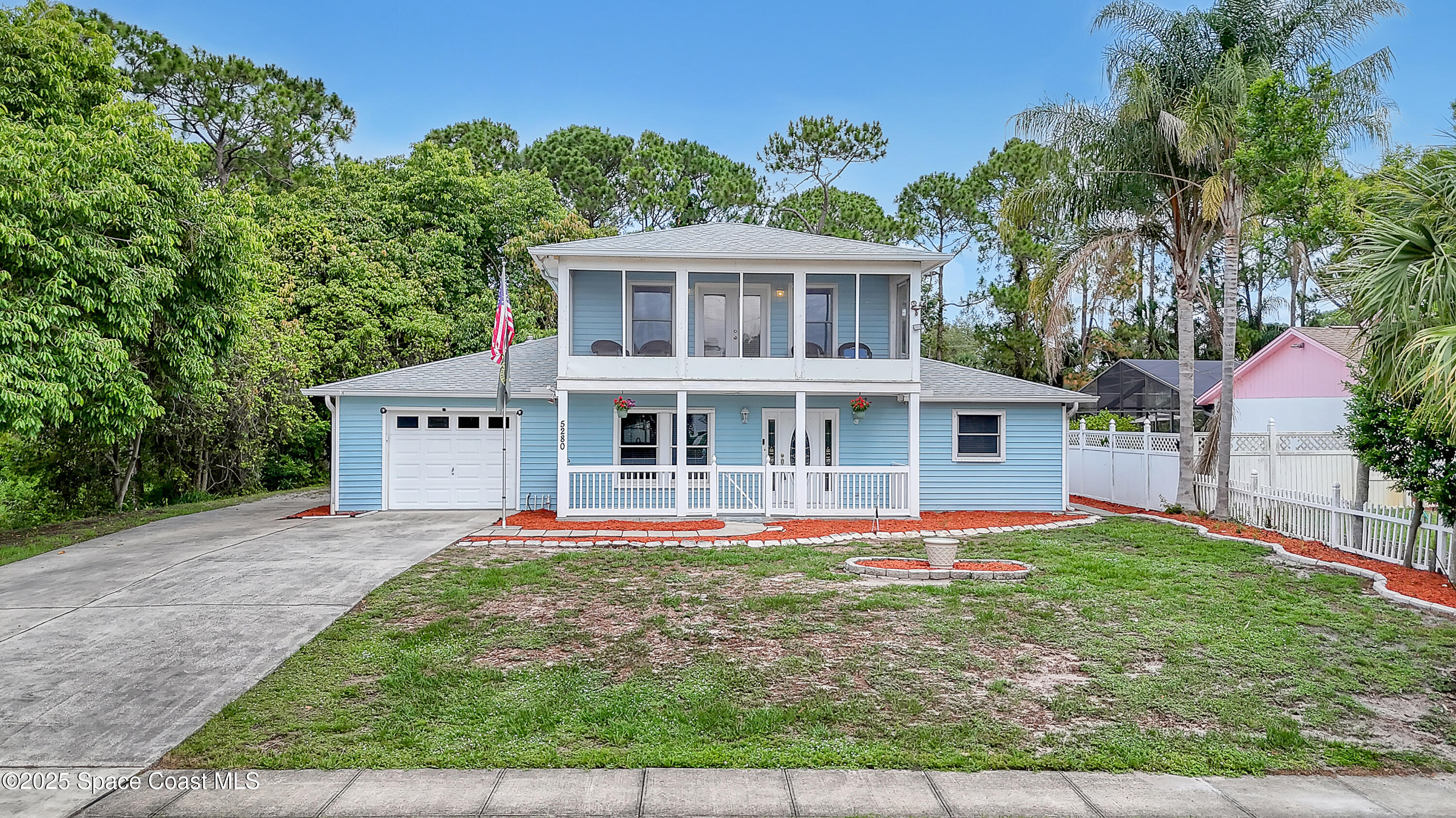 5280 Curtis Boulevard Cocoa, FL 32927 - Photo 42 of 45 front view of a house with a yard