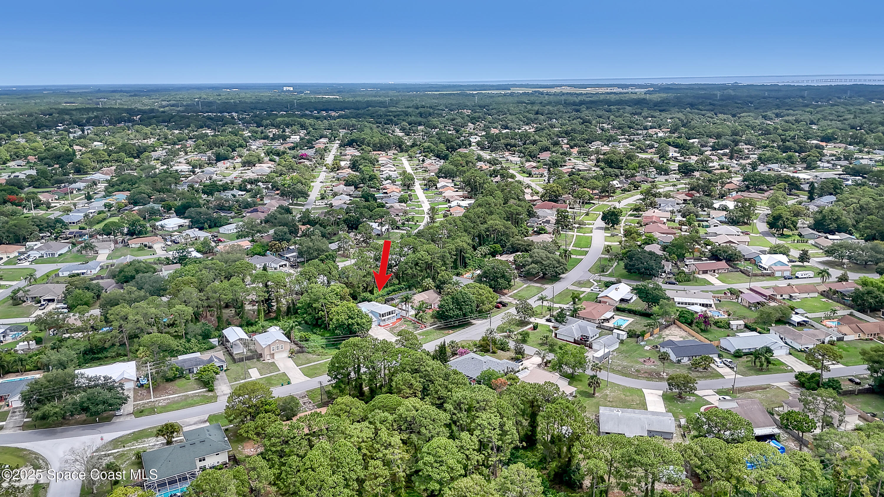 5280 Curtis Boulevard Cocoa, FL 32927 - Photo 43 of 45 an aerial view of residential houses with outdoor space and trees