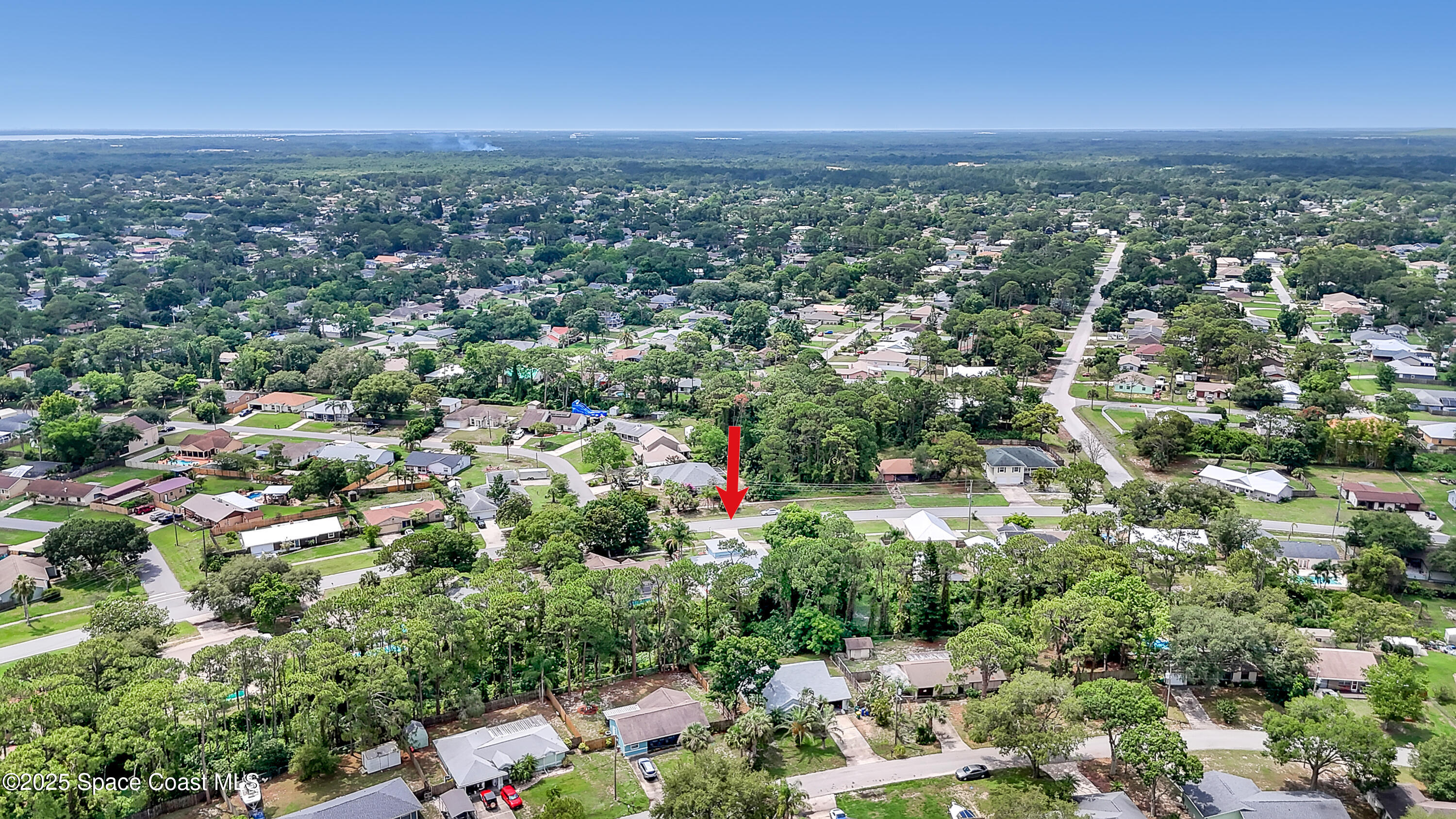 5280 Curtis Boulevard Cocoa, FL 32927 - Photo 45 of 45 an aerial view of a houses with a yard
