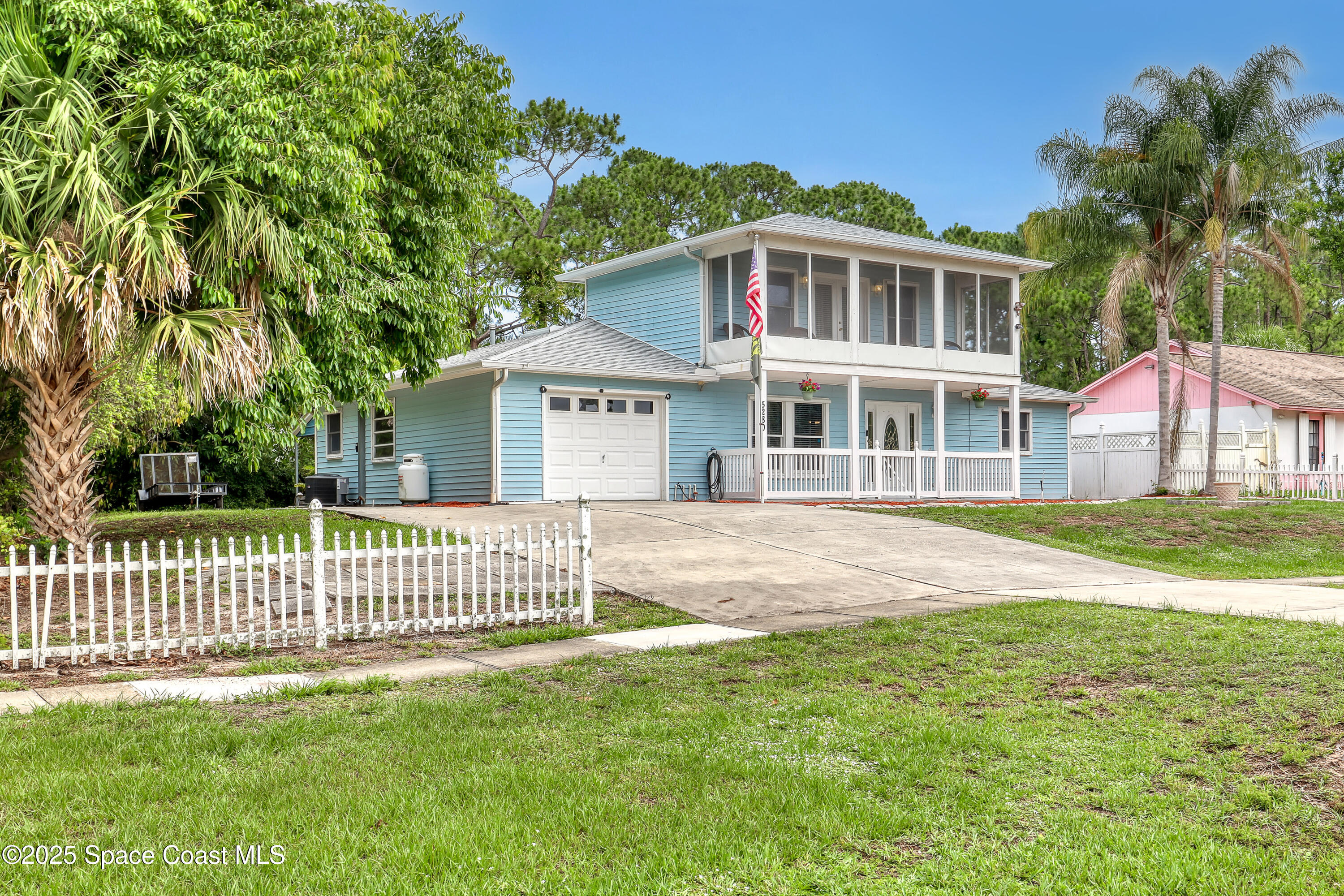 5280 Curtis Boulevard Cocoa, FL 32927 - Photo 8 of 45 a front view of a house with a garden