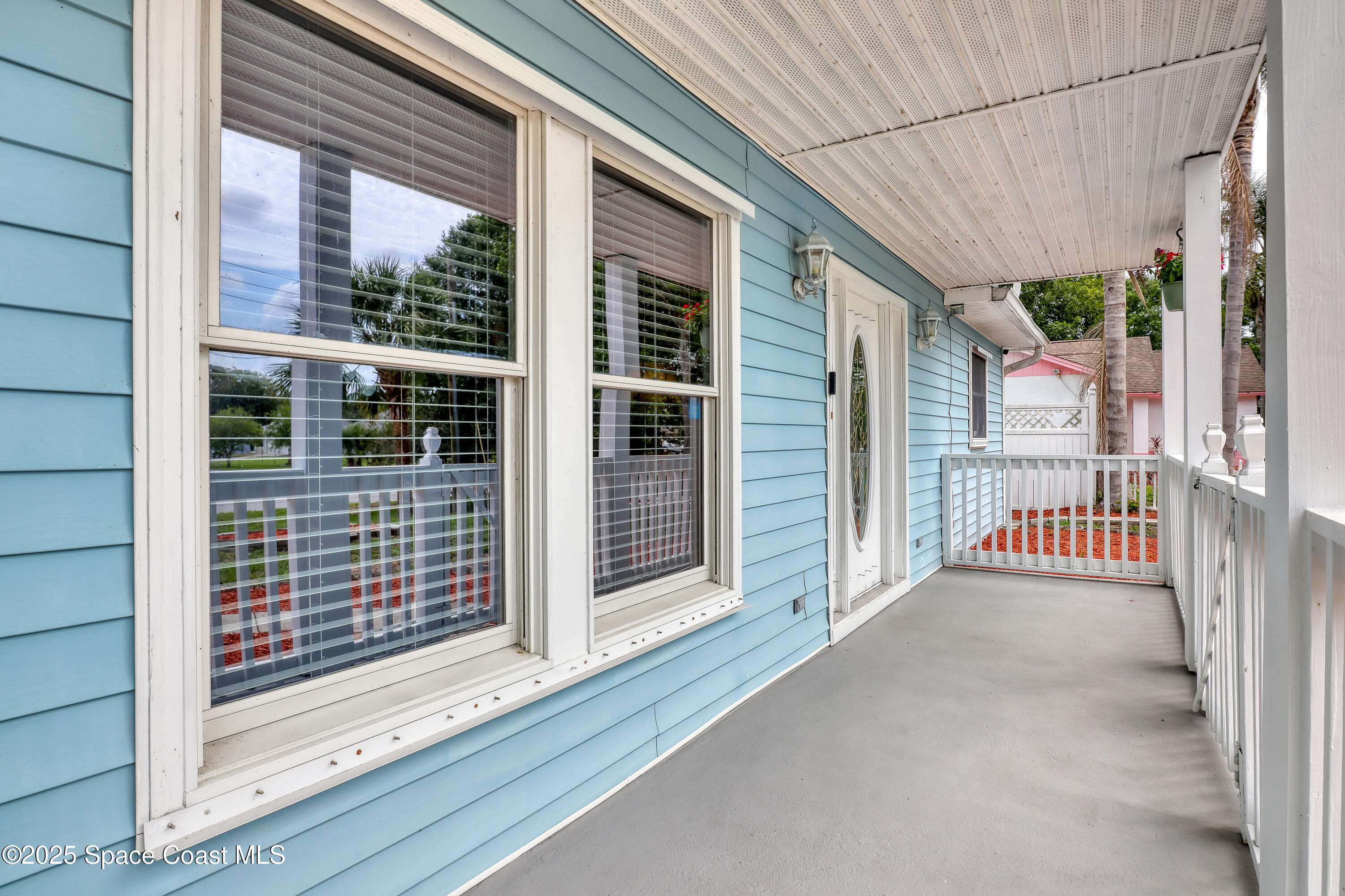 5280 Curtis Boulevard Cocoa, FL 32927 - Photo 10 of 45 a view of a porch with a door and wooden floor