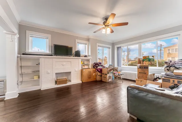 a living room with furniture fireplace and flat screen tv