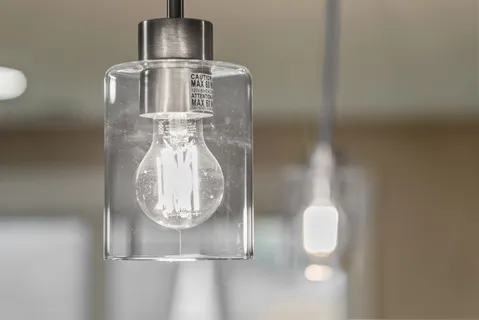 a close view of light fixtures and wooden floor