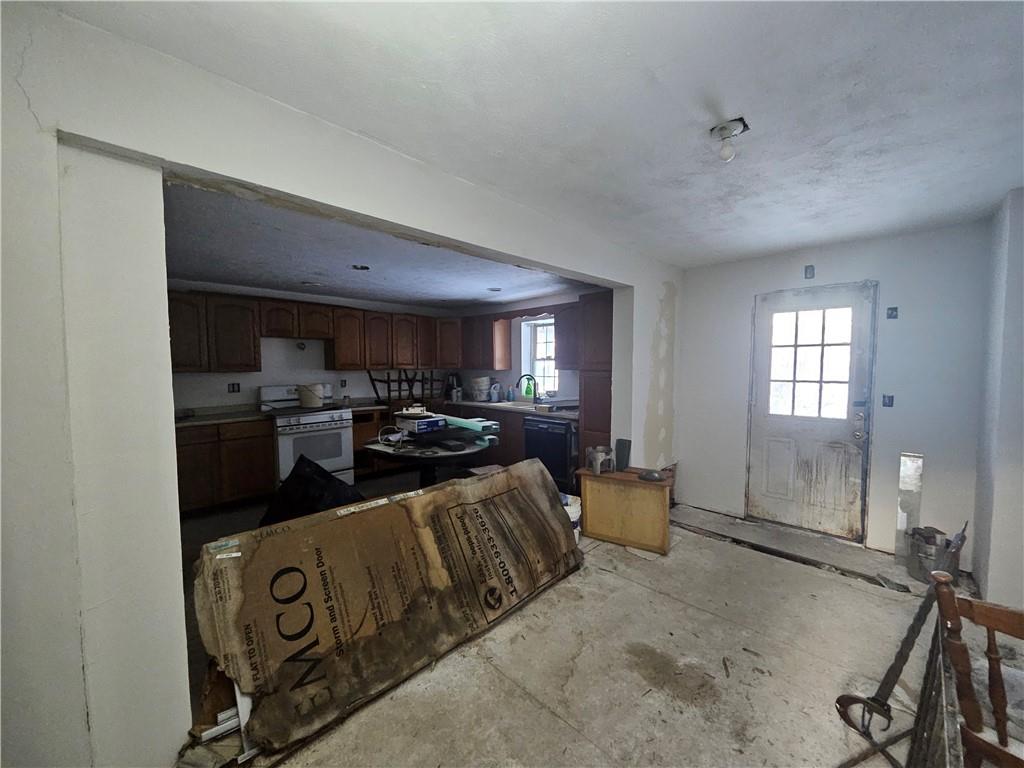 418 Ella Street Bloomfield, PA 15224 - Photo 5 of 14 a living room with furniture a window and kitchen view