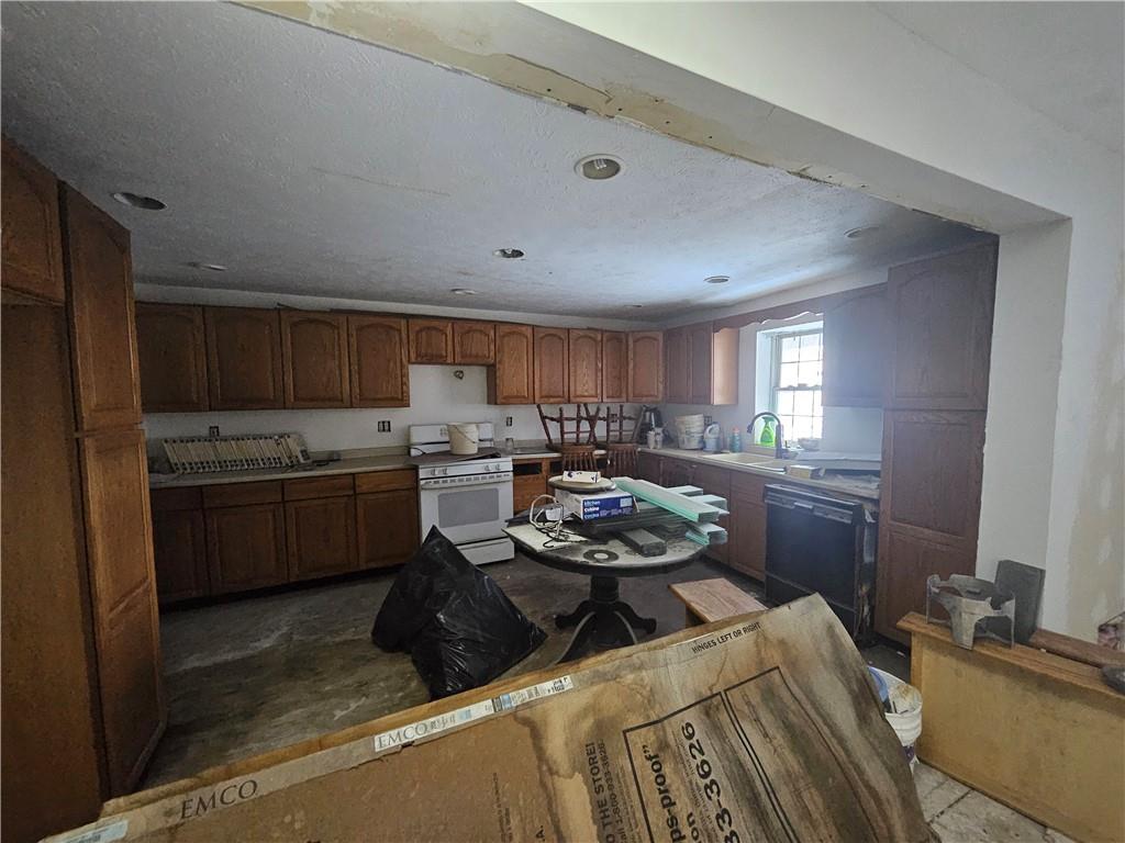 418 Ella Street Bloomfield, PA 15224 - Photo 6 of 14 a kitchen with a sink stove and cabinets