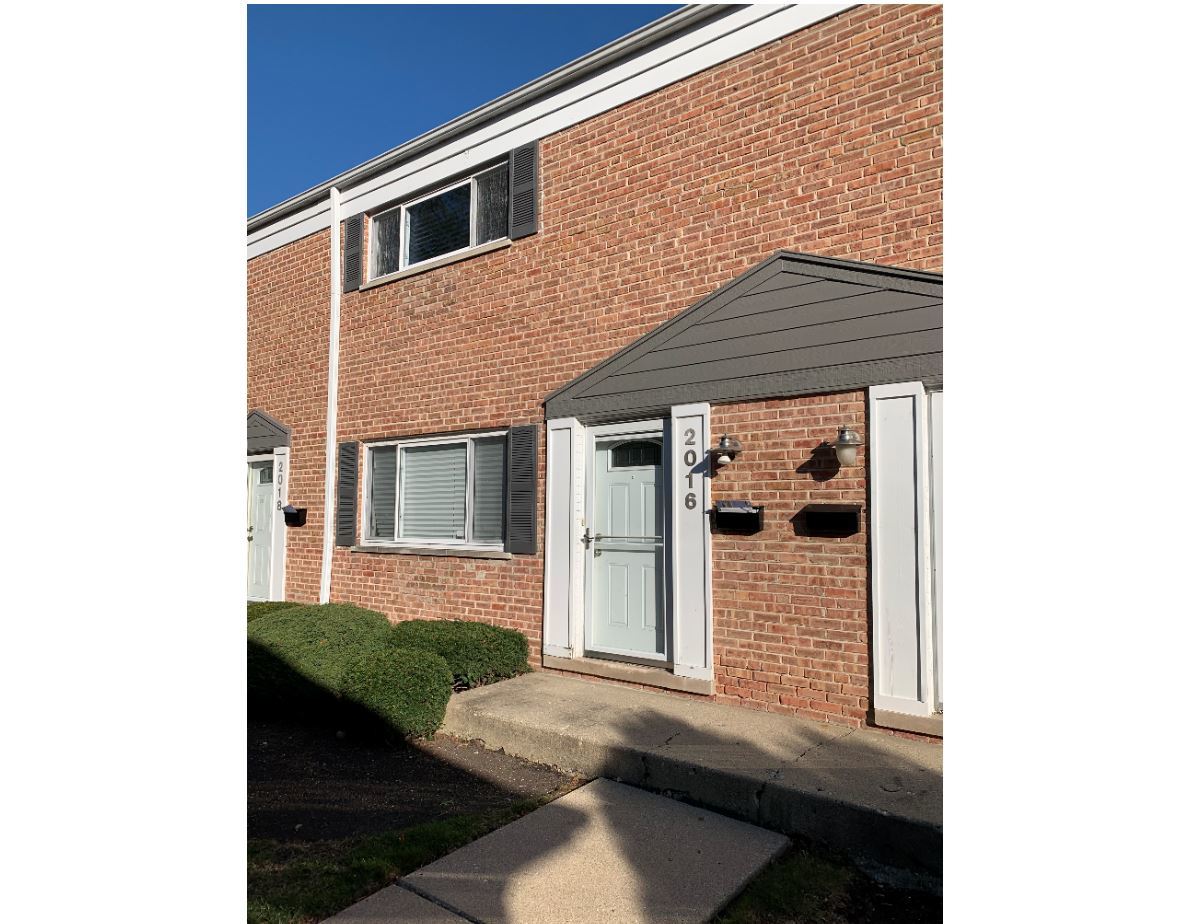 2016 Maple Avenue Northbrook, IL 60062 - Photo 2 of 32 a front view of a house with windows